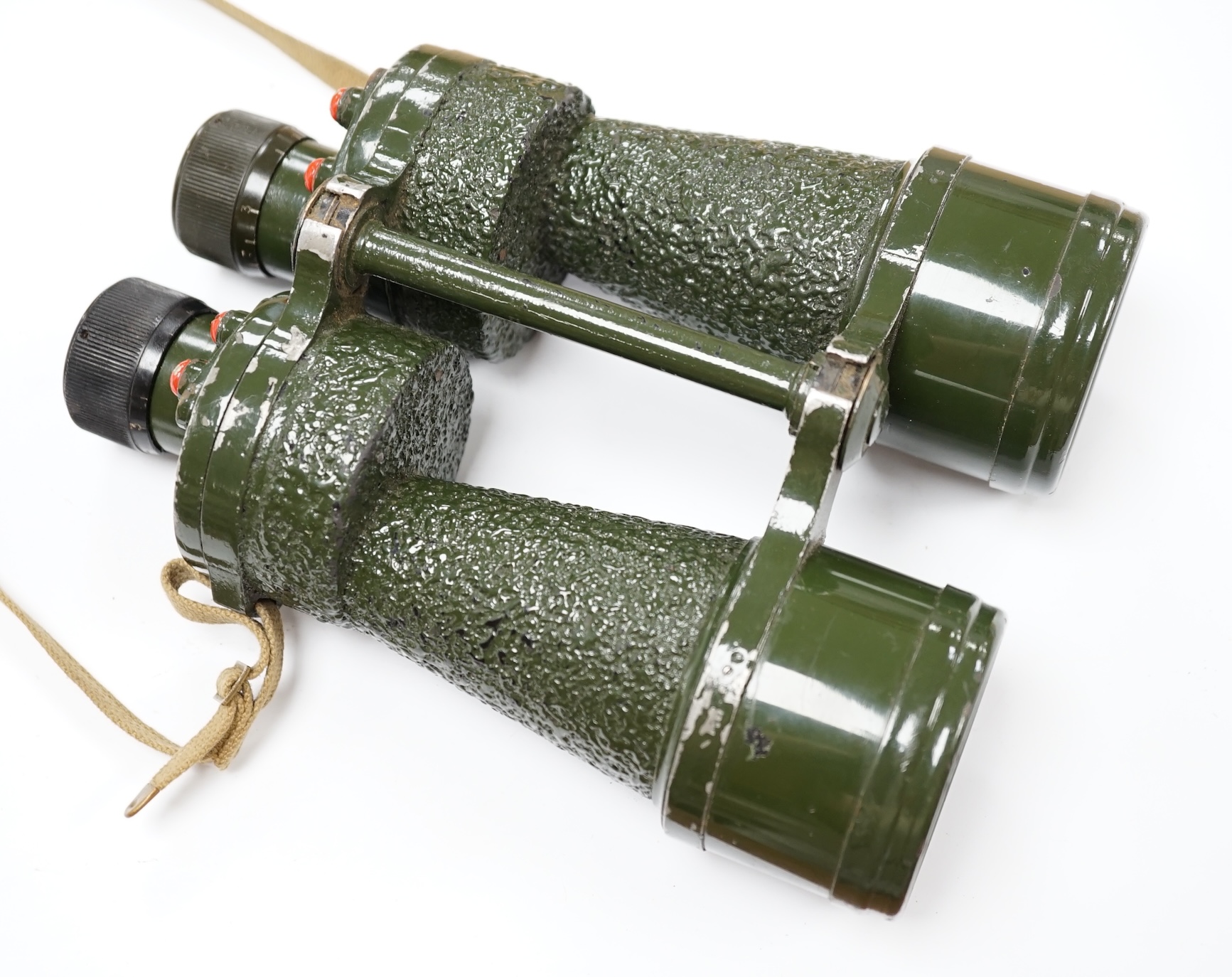 A pair of leather cased, green painted military Binoprism No.5 Mk.4 binoculars, dated 1943, the lid of the leather case impressed with; ‘ 1945 OS/997 Binocular Prismatic No.5 case Mk.1.’ Condition - fair to good, some an